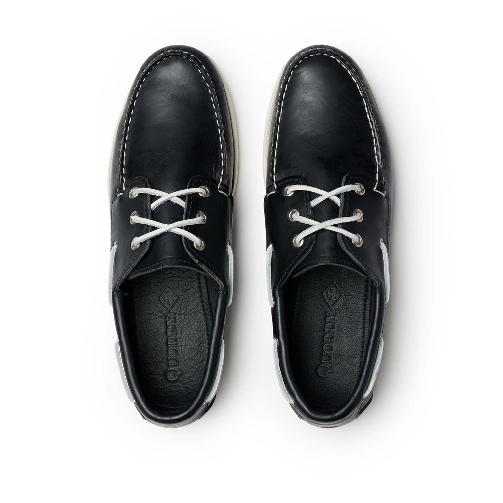 Men’s Quoddy Head Boat Shoes in Navy, top view, moccasin construction leather, boat sole, perimeter lacing, unlined, Quoddy
