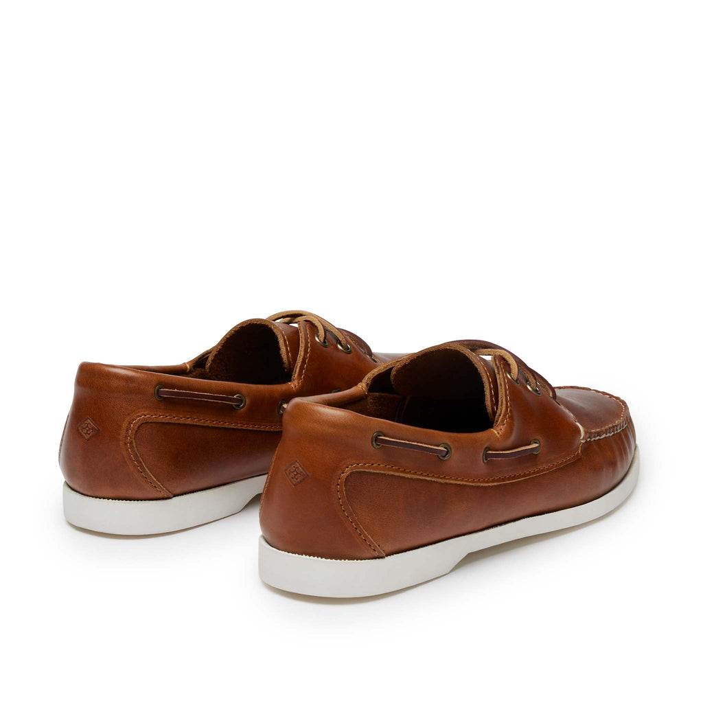 Men’s Quoddy Head Boat Shoes in Whiskey, rear view, moccasin construction leather, boat sole, perimeter lacing, unlined, Quoddy